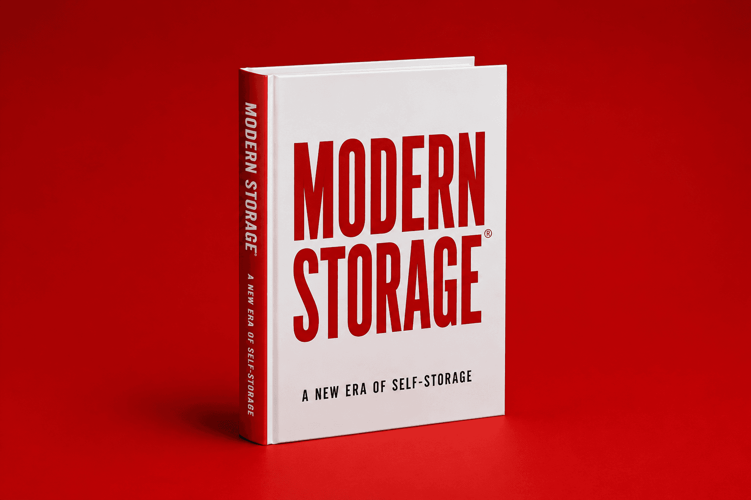 Modern Storage®: A New Era of Self-Storage — the official published book from Modern Storage®, hardcover second edition on a red backdrop with stacked copies, a Modern Storage® coffee mug, and a Modern Storage® keyring