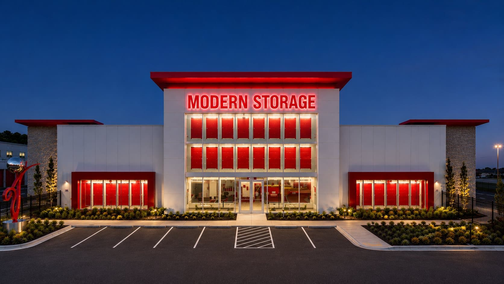 Modern Storage® Lowell facility at night with exterior lighting and gated access — Arkansas self-storage security