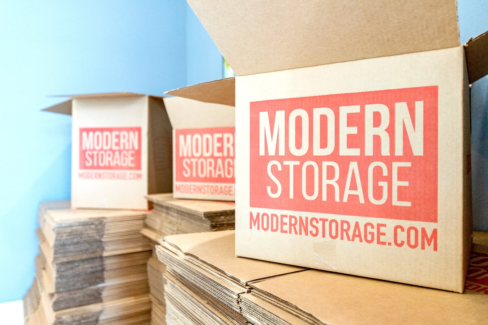 Stack of cardboard moving boxes packed and ready for storage during a home renovation