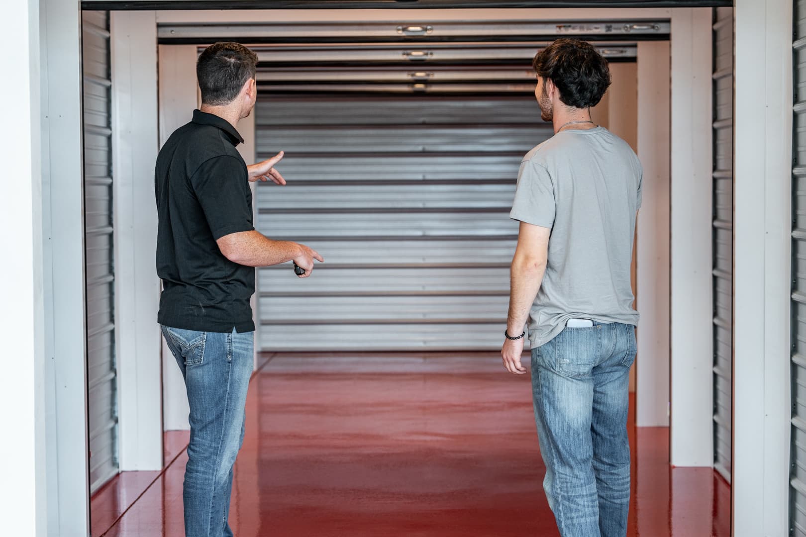 Modern Storage® team member giving a tour of a climate-controlled storage unit in Springdale