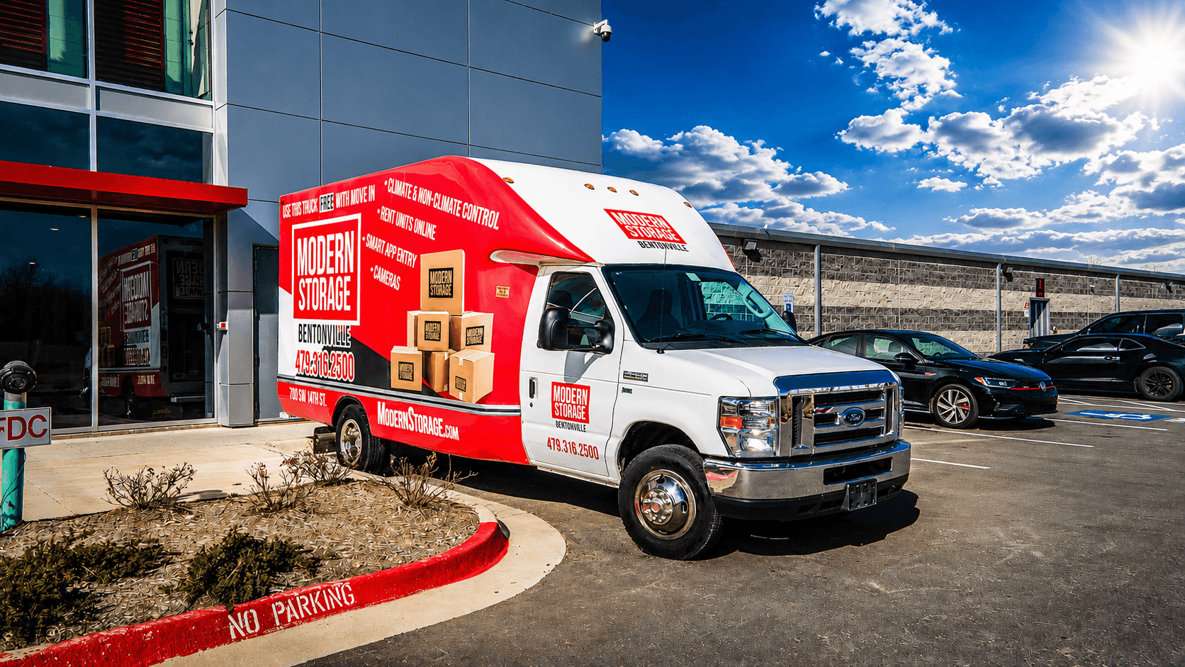 Modern Storage's free moving truck parked outside a storage facility, ready to make moving easier for new customers.