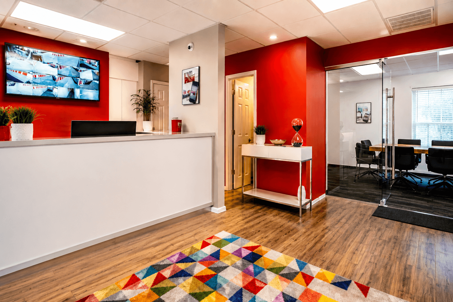 Modern Storage Maumelle reception lobby with customer service desk, security monitoring, and conference room.