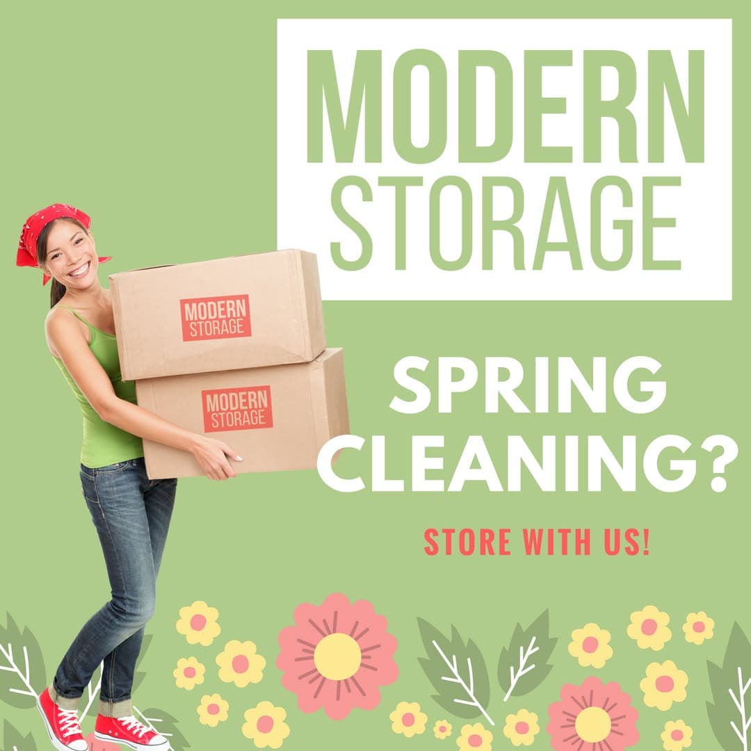 Person carrying moving boxes during spring cleaning with Modern Storage solutions for decluttering and extra space.