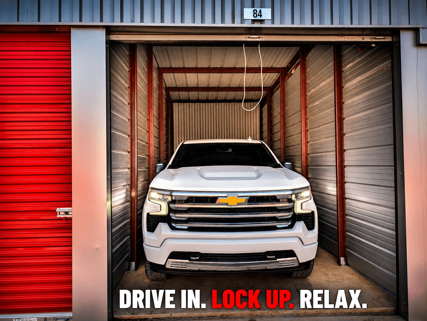 Full-size pickup truck parked inside a Modern Storage vehicle storage unit with convenient drive-up access.